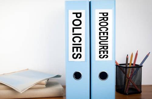 Two binders titled Policies and Procedures