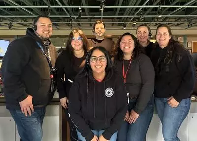 Dispatchers wearing matching black sweatshirts